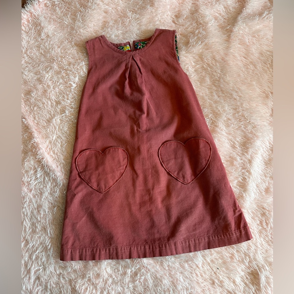 Mini Boden sweetheart dress with heart shaped pockets.